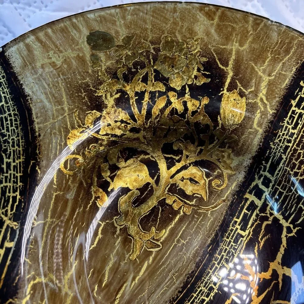 Glass bowl features an asymmetrical shape with a striking black and gold crackle